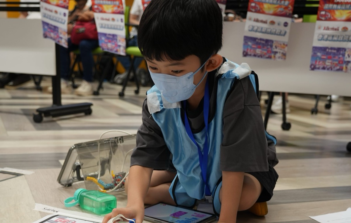 Beginner student placing his robot on the JBC game field